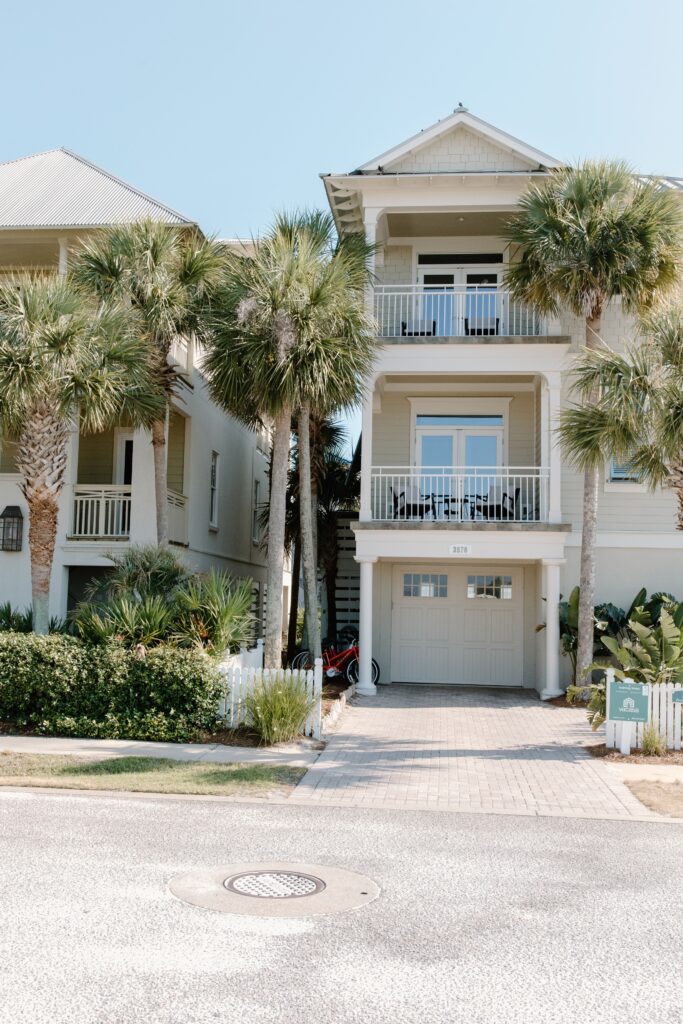 The exterior of a rental property in Florida with palm trees in the front